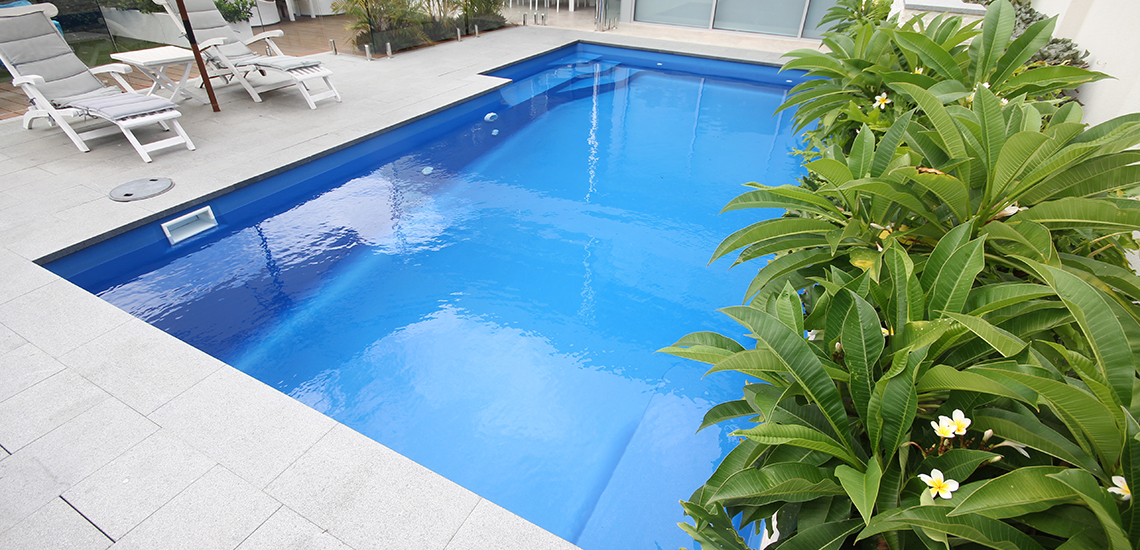 "Cayman" Fibreglass Swimming Pool with "Cyber Blue" Pool Colour